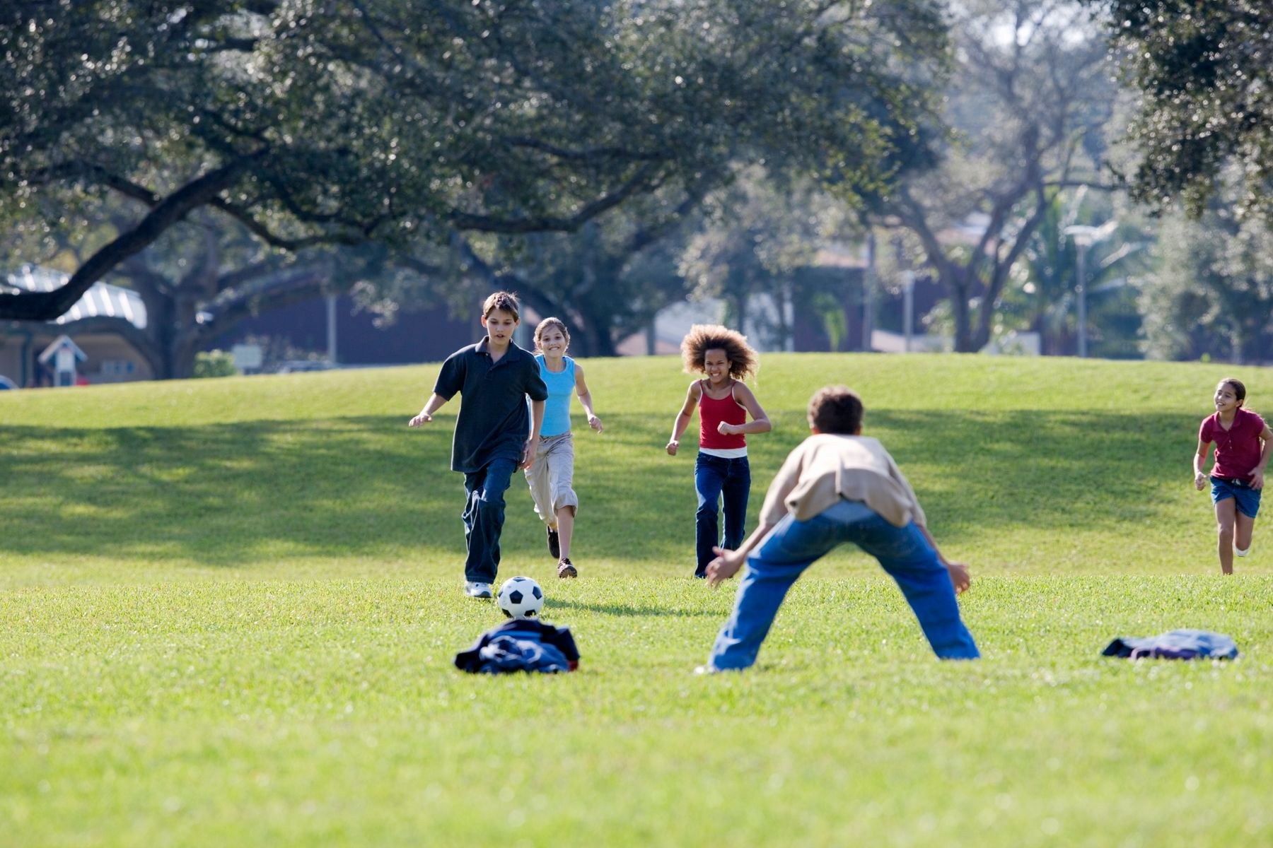 Children playing sports on a school ground